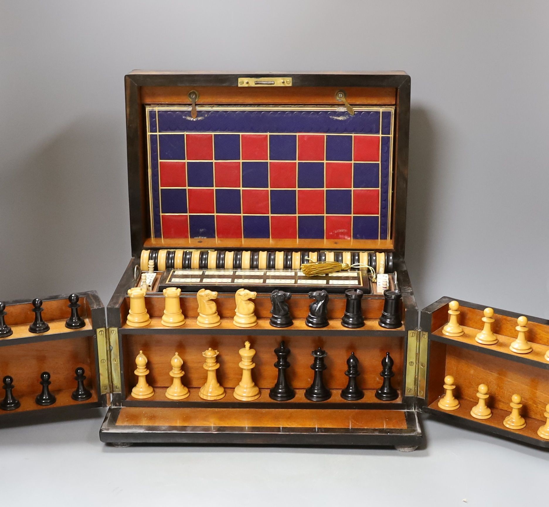 A Victorian walnut games compendium, 33cm wide